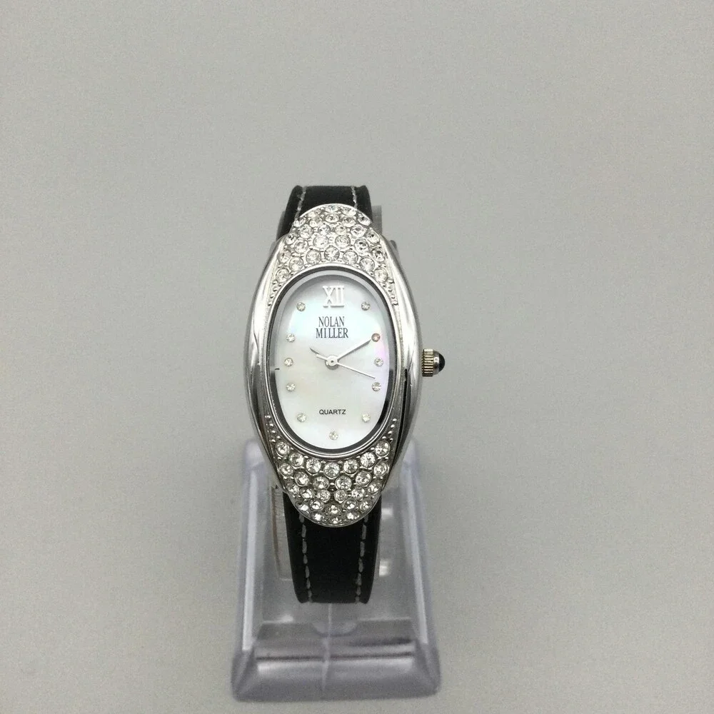 Nolan Miller Womens Watch 22mm Silver Crystals Black Leather MOP Oval Dial